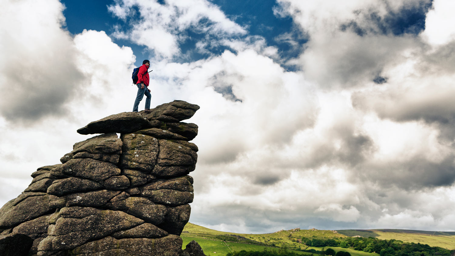 man standing on rocks
